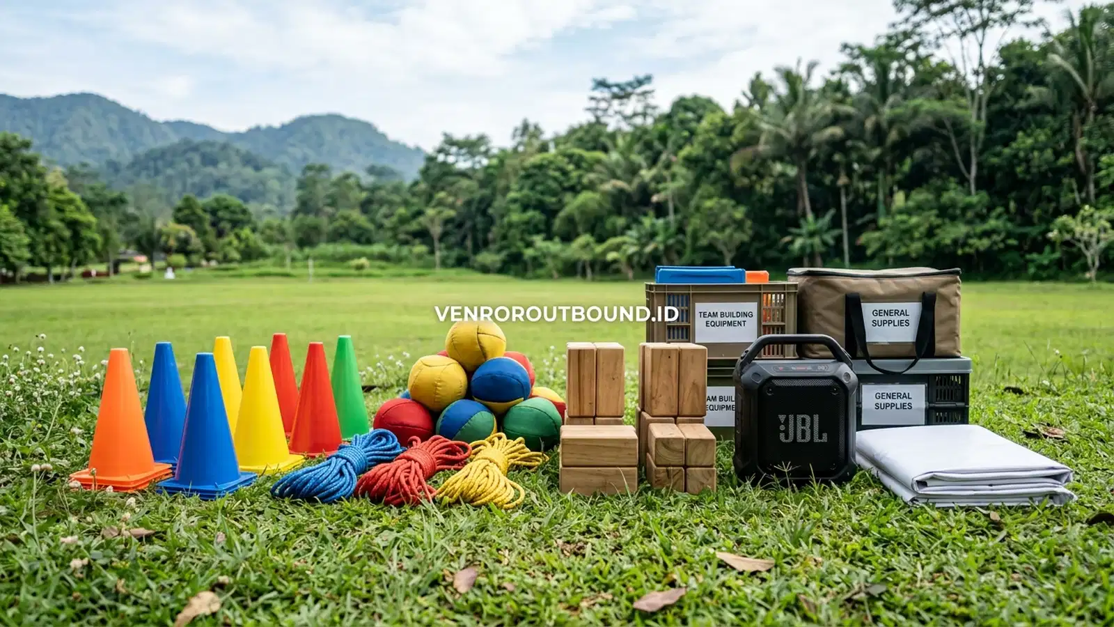 Perlengkapan fun games family gathering tertata rapi di rumput hijau kawasan sejuk Batu Malang